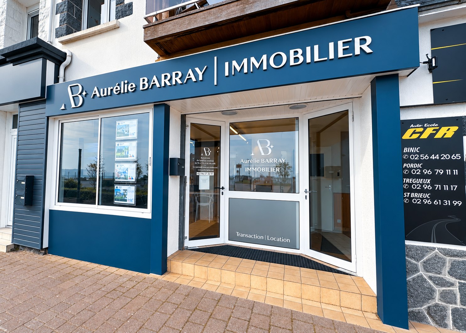 Enseigne Aurélie Barray Immobilier en inox brossé sur une devanture bleue